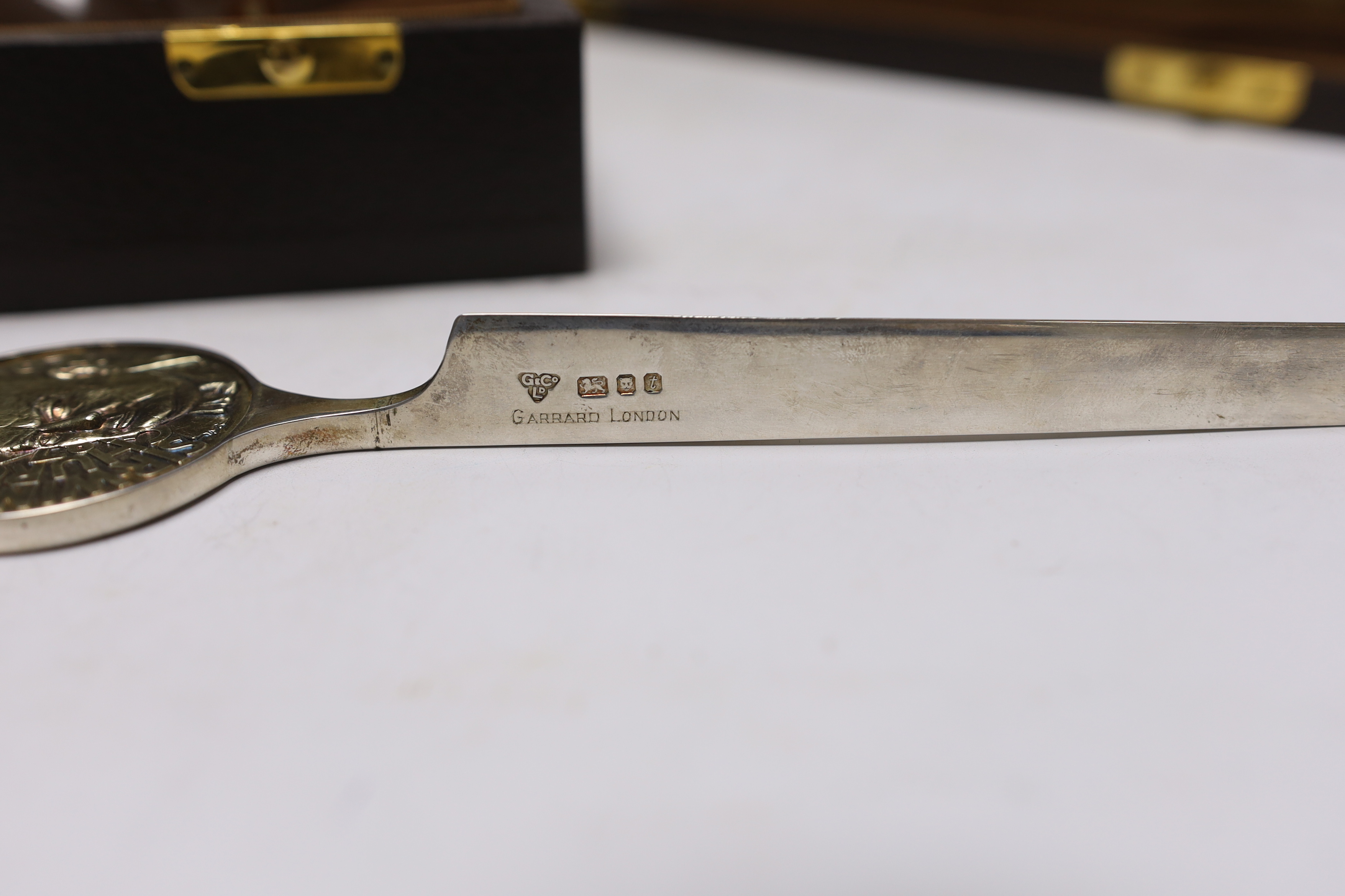 A Churchill commemorative silver letter opener and a commemorative Churchill decanter, Garrard & Co, boxed, letter opener 24.5cm long